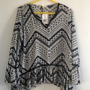 About a girl .. woman’s top size L. NWT
